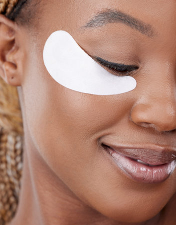 This is how she loves herself. Studio shot of an attractive young woman wearing an under eye patch...