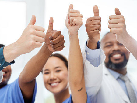 Weve got this. a group of doctors showing a thumbs up in a office.の写真素材