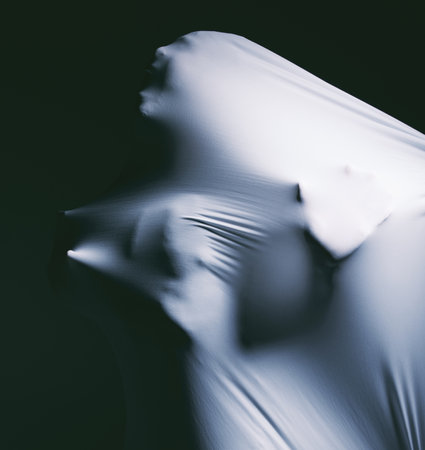 Trying to get through to the other side. a scary figure confined under a sheet.の写真素材