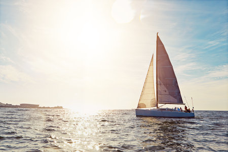 Mockup, sunset and a yacht at sea for travel, tourism or a luxury summer vacation outdoor. Blue sky,...