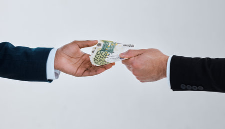 The worst disease in the world today is corruption. a businessman taking money from another man...
