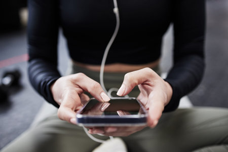 Download the app. a woman using her cellphone.