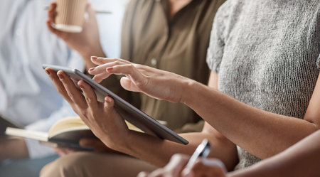 I can just follow along on my tablet. an unrecognizable businessperson using a digital tablet at...
