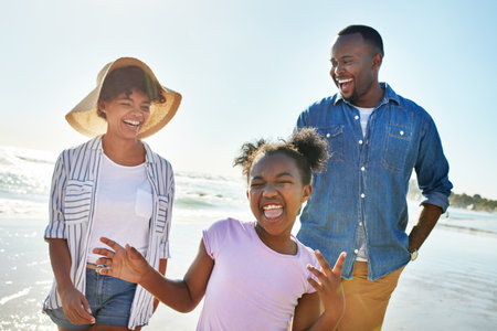 Beach, parents and portrait of African girl on holiday with a peace sign, crazy and funny in Australia. Comic, goofy and happy black family walking by the ocean to relax, travel and smile on vacationの写真素材