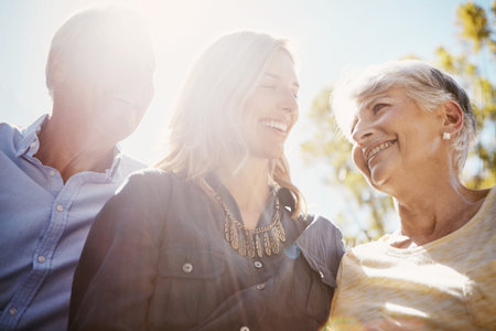 Woman, elderly parents and garden for sunshine lens flare, bonding or relax together in summer....