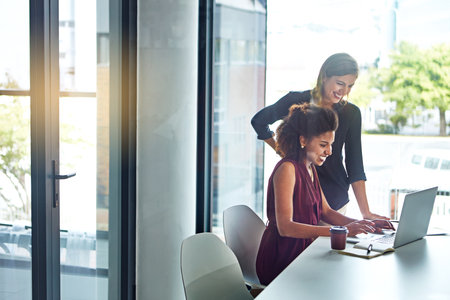 Success, data analysis or business women with laptop for business meeting, invest strategy or planning company finance. Collaboration, happy or teamwork on tax data analysis or financial networkの写真素材