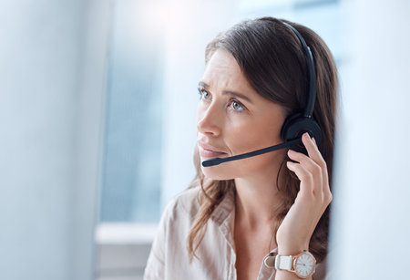 Yes I can fix that for you. a young businesswoman working in a call center.