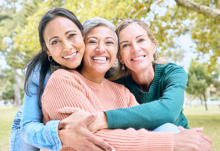 Retirement, women or bonding hug for portrait profile picture, social media or lifestyle freedom blog in relax environment. Smile, happy or elderly senior friends in nature park, garden or communityの写真素材