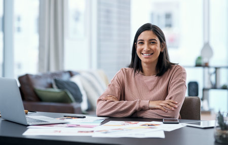 All set for freelancing success. Portrait of a confident young woman working from home.の写真素材