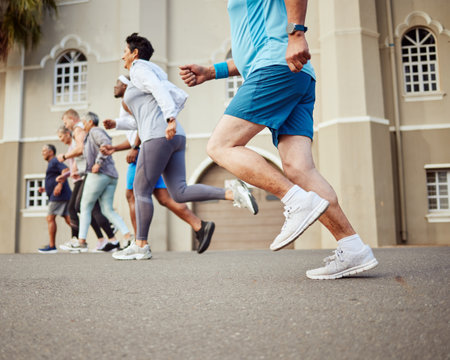 Fitness, senior or people running in a marathon race or cardio exercise challenge on city street road for wellness. Sports community, workout or healthy elderly runners training as a retirement groupの写真素材