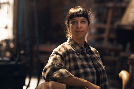Metal is my business. Portrait of a confident young woman working at a foundry.