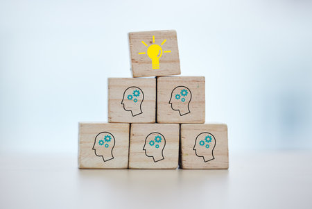 Building blocks, teamwork or brainstorming lightbulb idea on isolated background, mock up or office desk mockup. Zoom, wood or cube in cog head innovation for company thinking or unity growth successの写真素材