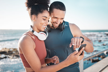 Fitness, couple and phone with smile for social media, communication or discussion relaxing by the...
