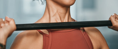 Gym fitness, barbell and black woman doing muscle performance exercise for body health, strength training or bodybuilding. Arm workout, athlete wellness lifestyle and strong bodybuilder weightliftingの写真素材