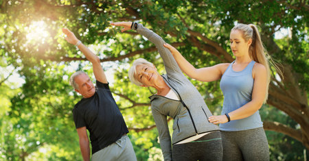 Their vitality has never left them. an instructor guiding a senior couple in a yoga class.