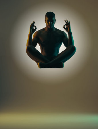 Meditation shadow, float or relax man meditate in spiritual mental health, chakra energy balance or soul aura healing. Zen mindset peace, mindfulness or model silhouette isolated on studio backgroundの写真素材