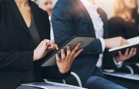 Im getting a lot of advice here. a group of businesspeople sitting in the conference room during a...