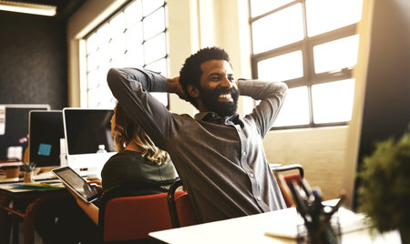 Take advantage of the benefits technology has to offer. a handsome businessman sitting at his desk...