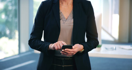 Keep your connections for when opportunity strikes. Closeup shot of a businesswoman texting on a...