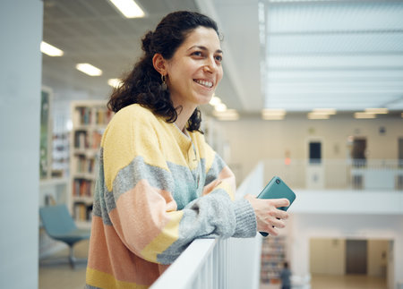 University, happy professor or teacher woman with research goals, vision for success and excited for knowledge teaching. Campus, college or school person thinking of education and creative studyの写真素材