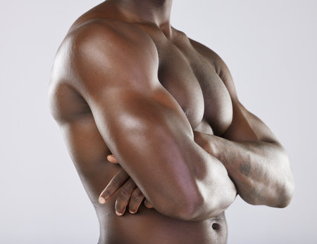 Black man, strong arms and muscle for fitness, exercise workout and bodybuilder sports wellness. African male, arm health wellness mockup and model skincare or model body care in white backgroundの写真素材