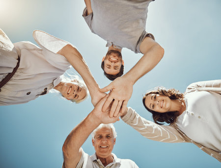 Low angle, support and hands pile portrait of happy family in park bonding, house garden or home...