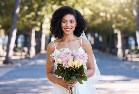 Black woman, wedding and bride portrait with bouquet of roses happy about love celebration. Street, happiness and flowers of a young person smile at marriage commitment event smiling outdoorの写真素材