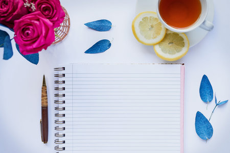 Everything has its place. Studio shot of a diary and pen placed with other still life objects...