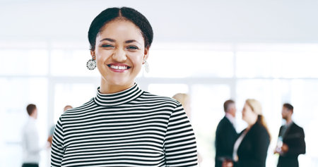 Positivity breads productivity. Cropped portrait of an attractive young businesswoman standing in...