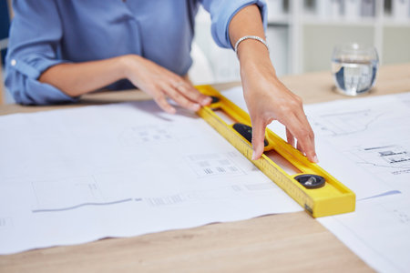 Architect, woman and blueprint with hands of an engineer drawing plan on paper for property...