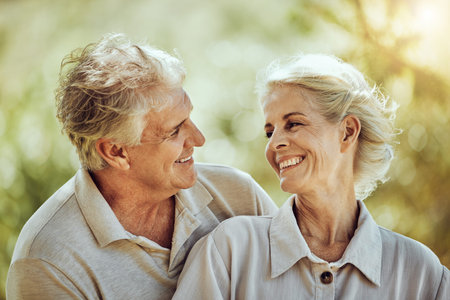 Love, hug or happy old couple in nature bonding or laughing in a marriage partnership in retirement....