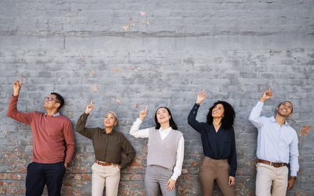 Diversity, wall and happy business people pointing at mockup space, marketing mock up or advertising. Collaboration, teamwork or row of company employee group with hand gesture for hiring recruitmentの写真素材