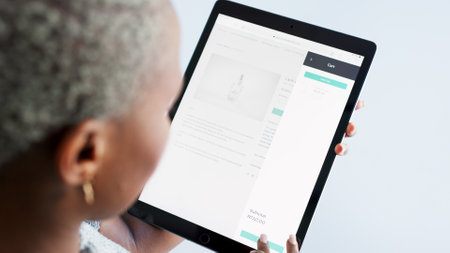 Black woman, tablet and contact us design for digital marketing startup, creative company and advertising business. Top view, zoom or hands of worker with brand website and media survey on technologyの写真素材