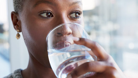 Happy girl drinking water while relax in restaurant, cafe or shop and enjoy calm summer day peace...
