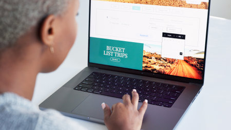 Laptop, hand and bucket list with a woman on the search online for an idea for a trip, holiday or vacation. Website, thinking and planning with a female looking on the internet for an adventureの写真素材