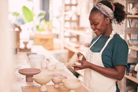Ceramic store, creative pottery and black woman working on sculpture design mold, manufacturing or art product. Creativity, molding and startup small business owner, worker or girl in studio workshopの写真素材