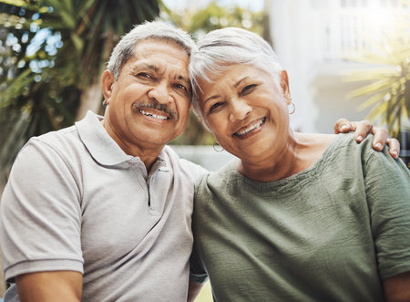 Senior african couple, smile portrait and hug for love, support and care in relationship embrace, bond or happiness outdoor. Romance, happy marriage or elderly black man and woman on holiday togetherの写真素材
