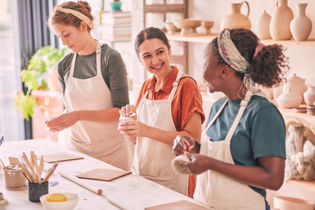 Pottery class, group workshop or happy woman design sculpture mold, clay manufacturing or art product. Diversity, ceramic retail store or startup small business owner, artist or studio people moldingの写真素材