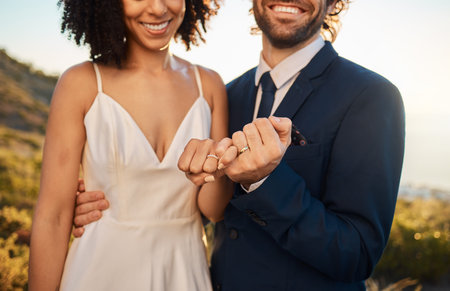 Pink promise, marriage and wedding couple hands together outdoor for trust, love and care. Support,...