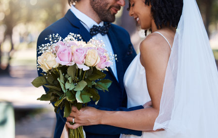 Wedding, couple and hug with flower bouquet outdoor at marriage celebration event for bride and...