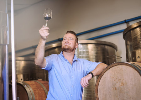 I believe in making delicious, value-for-money wines. a man enjoying wine tasting in his distillery.