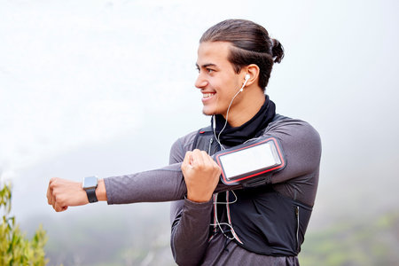 Runner man, stretching arms and mountain with happiness, vision and phone for fitness, wellness or...