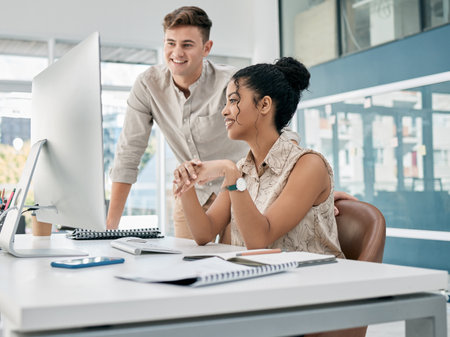 Computer, discussion and team working on a project together for collaboration in the office. Technology, mentor and professional manager training an employee with corporate report in the workplace.の写真素材