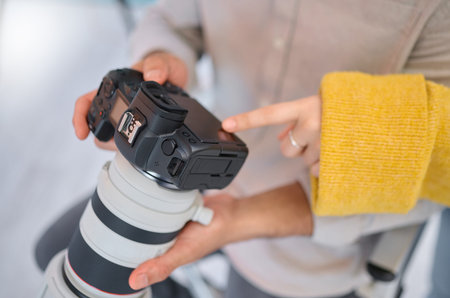 Camera, hands and photography for a digital agency or magazine company looking at tech setting....
