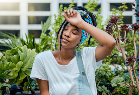 Tired, gardener or black woman with fatigue, burnout or stress after cleaning dirty plants or...