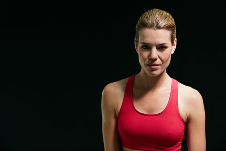Addicted to fitness. Cropped portrait of an attractive young woman in workout attire.の写真素材