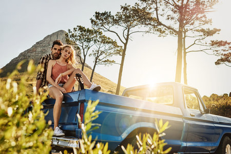 Traveling together can only make your relationship stronger. an affectionate couple pulling over to...
