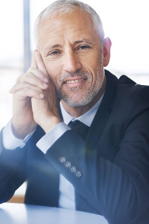 Be the master of your own success. Portrait of a mature businessman looking thoughtful while sitting...