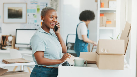 Ecommerce, box and phone call communication for girl in conversation, discussion or talking about product shipping. Supply chain, online shopping sale and black woman speaking on 5g smartphone callの写真素材