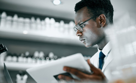 Science, laboratory and black man with tablet for research, medical analysis and experiment results....